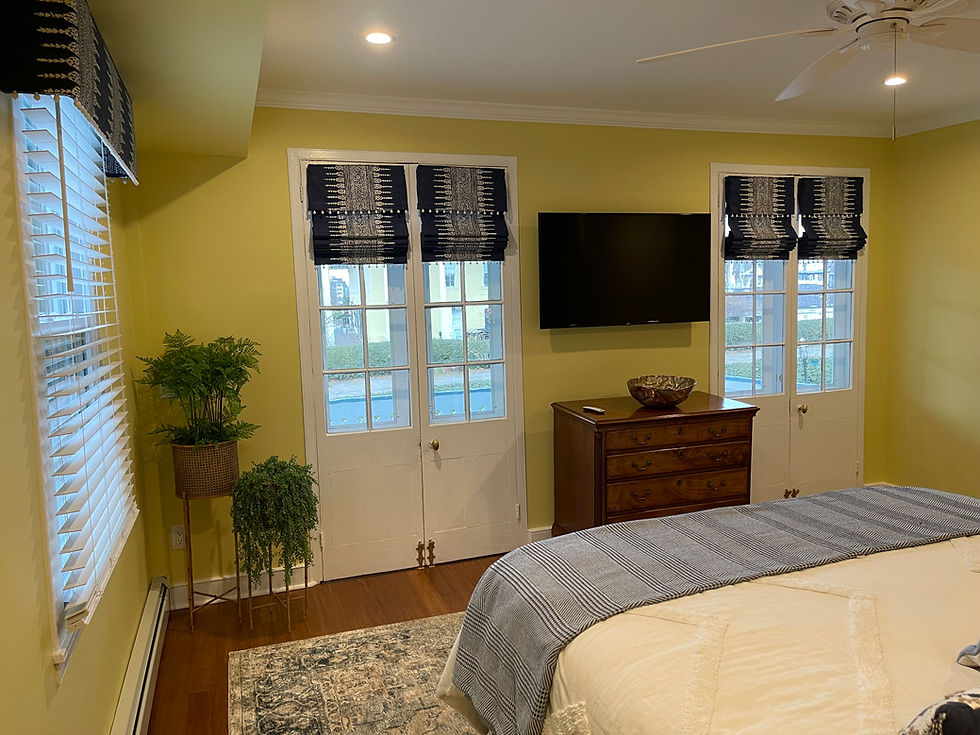 My longtime client loves color—especially yellow—so I paired it with a complementary blue and collaborated with one of my window treatment vendors to create these custom Roman shades for the primary bedroom in their beach house. They turned out to be the perfect complimentary element.