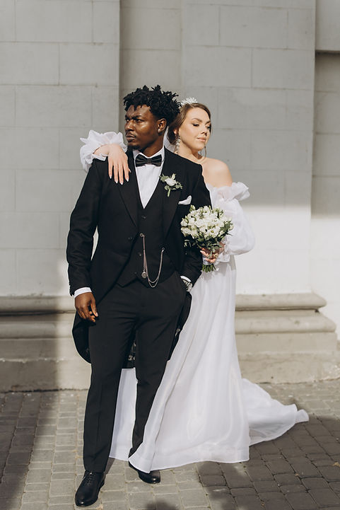 Newlywed couple posing together after intimate wedding ceremony officiated by Rooted in Love