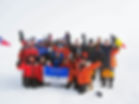 A team celebrates at the South Pole during our South Pole Flight
