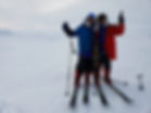 A group of skiers celebrate after skiing the the North Pole on our North Pole Last Degree ski trek.