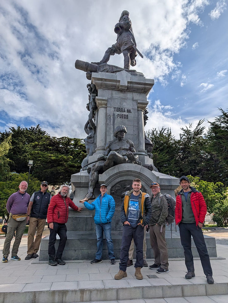 Our team at the statue honoring Ferdinand Magellan. It's good luck to rub his foot which is why it's so shiny!