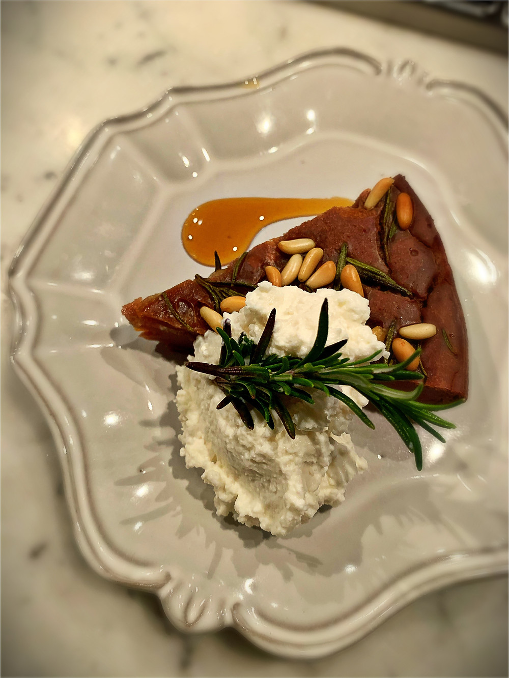 Castagnaccio with fresh ricotta
