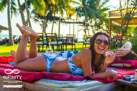 Guest lounging by the pool at Infinity Beach Club, Koh Phangan