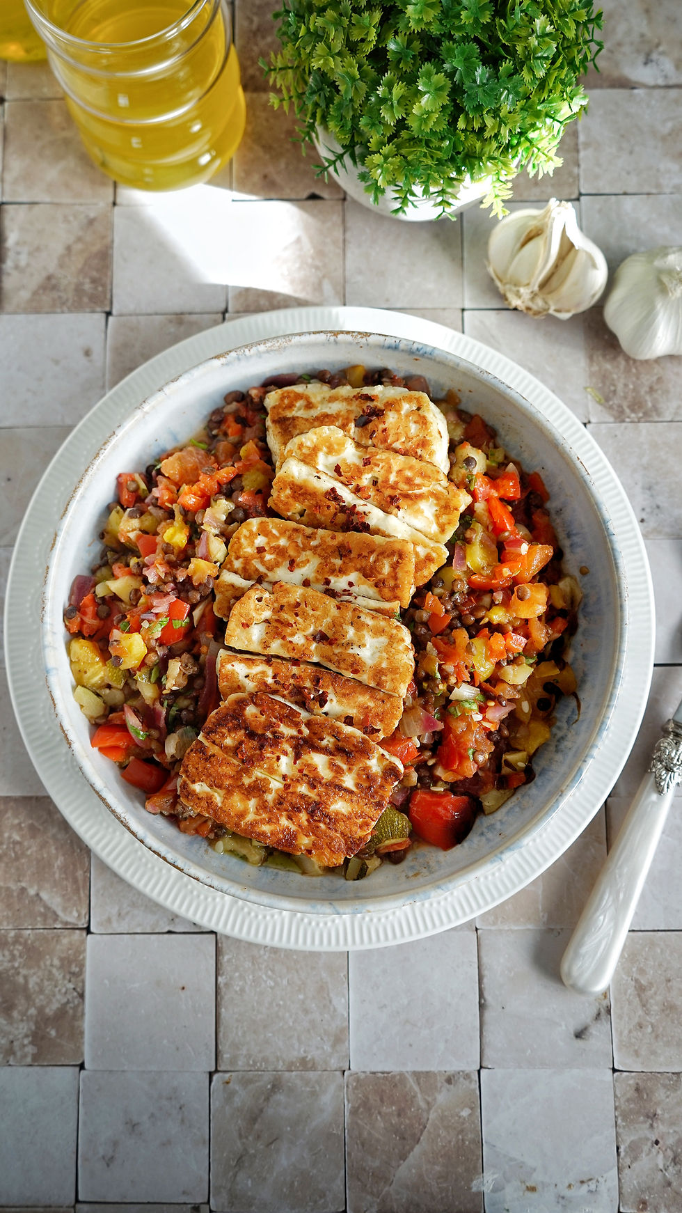 Eye-level view of sautéed vegetables in a skillet