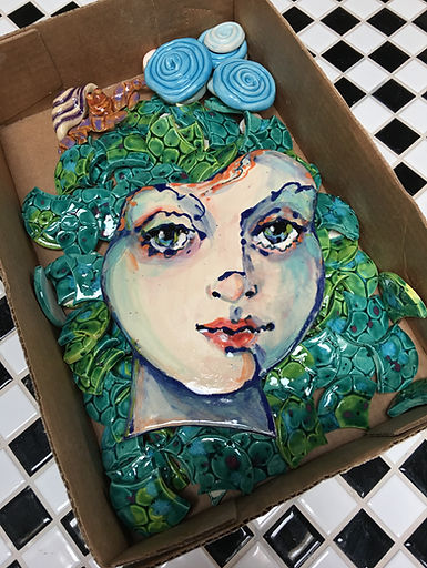 mermaid face on tail tiles.JPG