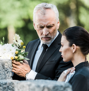 selective-focus-of-upset-man-holding-flowers-and-s-L9Z6T47.jpg