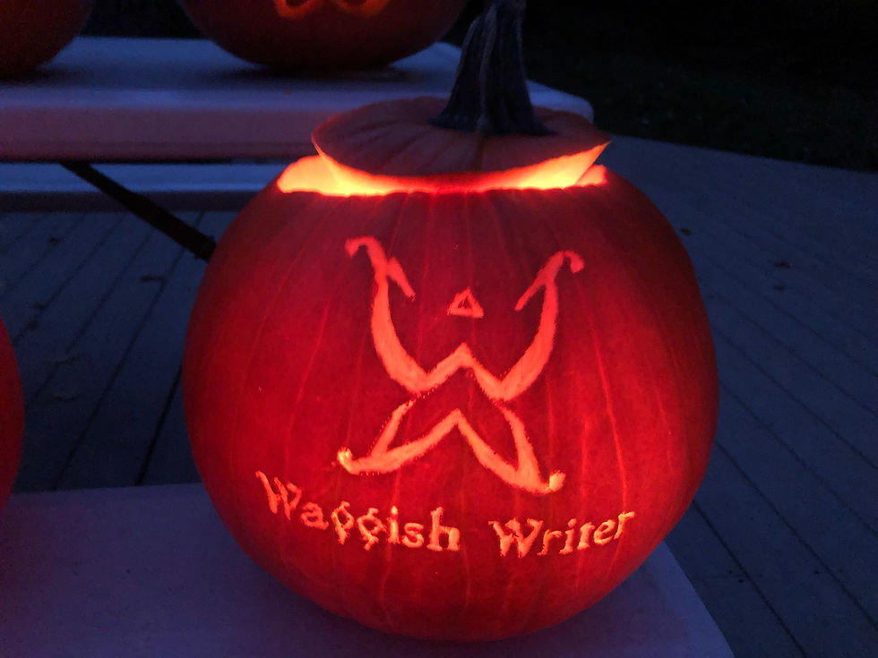 A pumpkin with an off-center top with the Waggish Writer's logo, a butterfly made of two Ws, flutters above the business name.