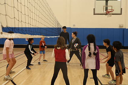 Children participating in a beginner volleyball session.