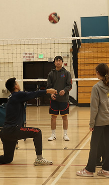 Coach demonstrating setting volleyball techniques