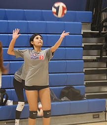 Girl Club Team practicing volleyball serves
