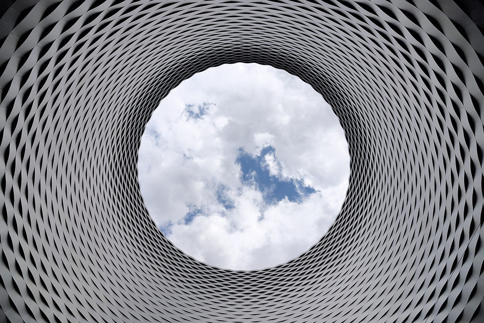 looking at the clouds through a tunnel
