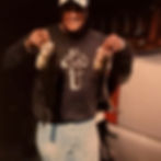 Cassandra Jackson's father holding freshly caught fish