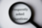 frequently asked questions viewed through a magnifying glass