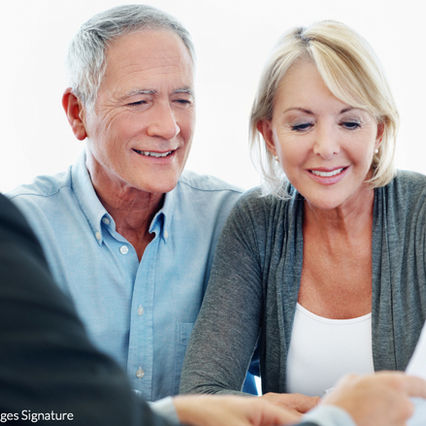 Financial advisor reviewing annuity information with older couple