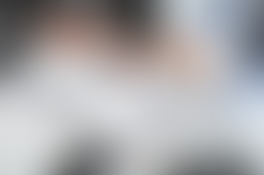 Two men at desk going over life insurance policy