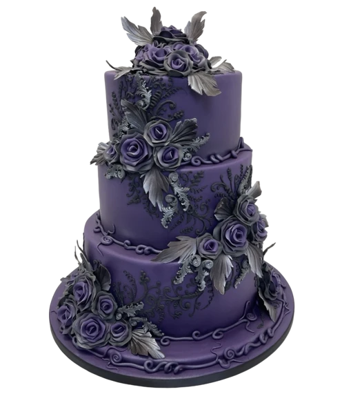 Three-tiered purple wedding cake with silver sugar paste flowers and intricate details.