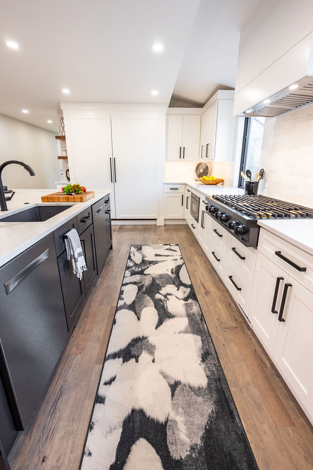 kitchen runner with dishwashers and rangetop