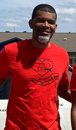 Man in red shirt with logo