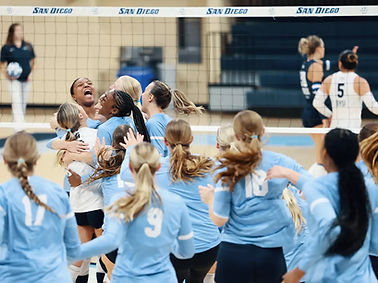 USD Volleyball celebrating after win versus BYU