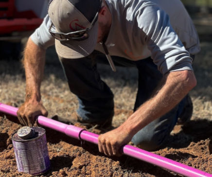 Tech making repairs on an aerobic septic system