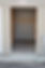 Image shows small enclosed storage space available for rent with a concrete floor and overhead, roll-up door.