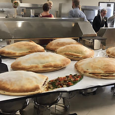 lots of calzones ready for a caering event