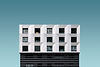 metal-silver-black-modern-building-blue-sky.jpg