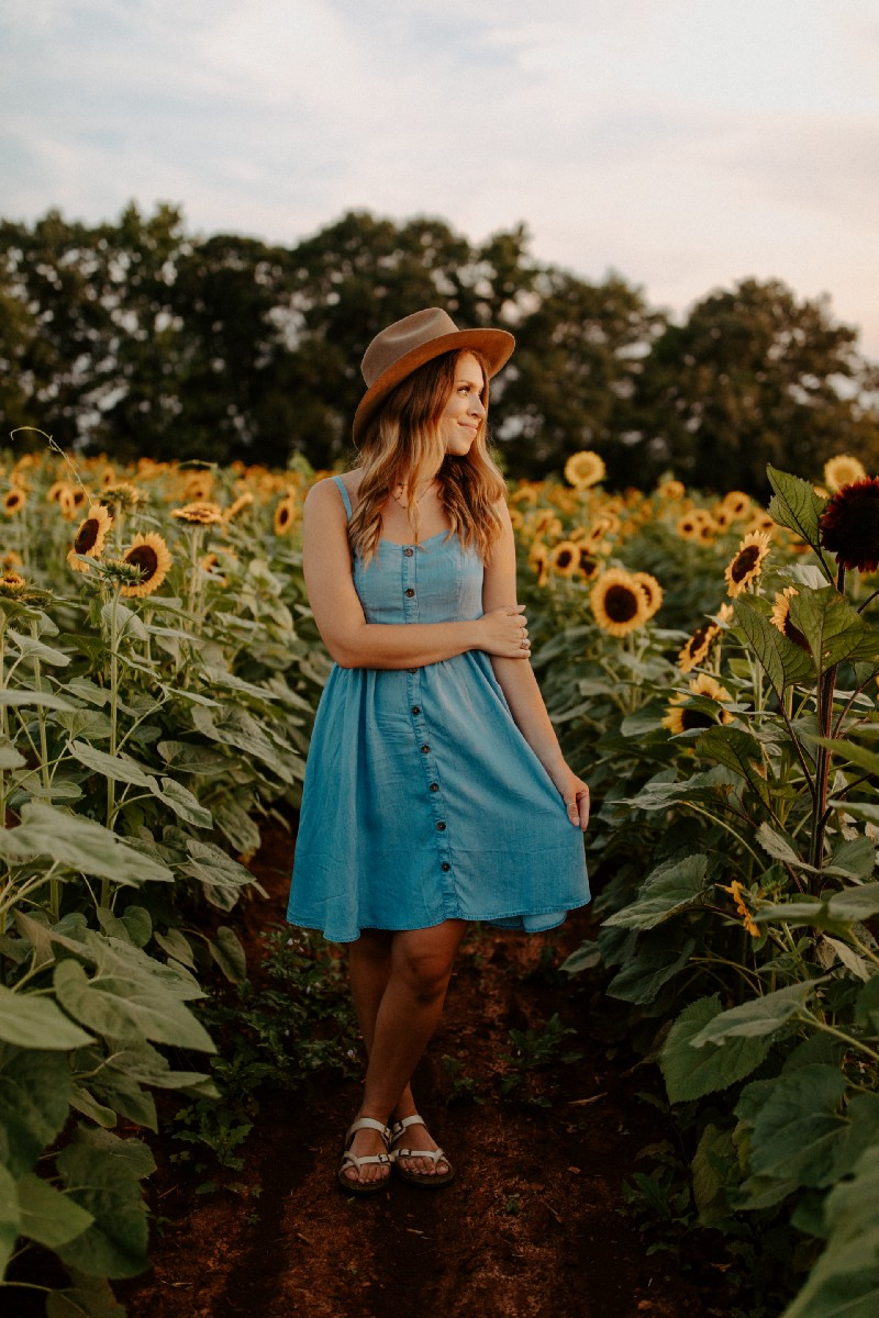 Environmentalist alone in sunflower field