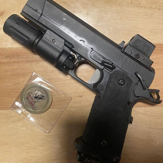 Figure 2 Pistol with YeagerFest Coin