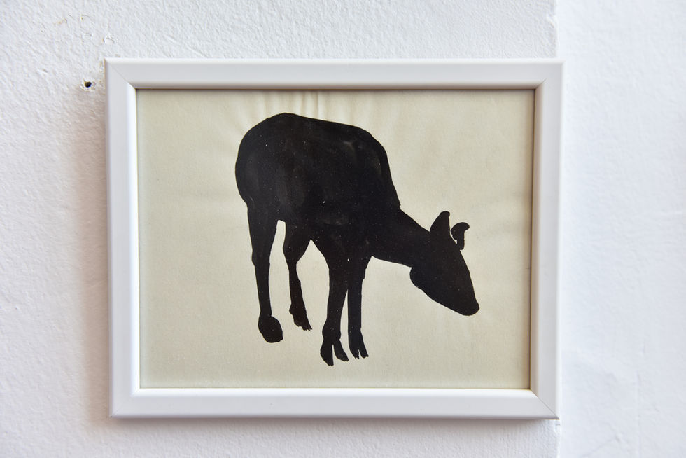 Framed croquis drawing of a deer using only black shadow. 