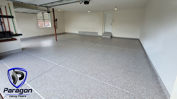 Decorative flake epoxy garage floor installed by Paragon Epoxy Floors in Longboat Key, Florida featuring commercial-grade surface preparation, premium flake broadcast, and a durable polyaspartic topcoat.