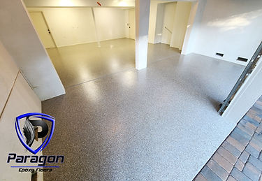 Decorative flake epoxy garage floor installed by Paragon Epoxy Floors in Siesta Key, Florida featuring commercial-grade surface preparation, premium flake broadcast, and a durable polyaspartic topcoat.