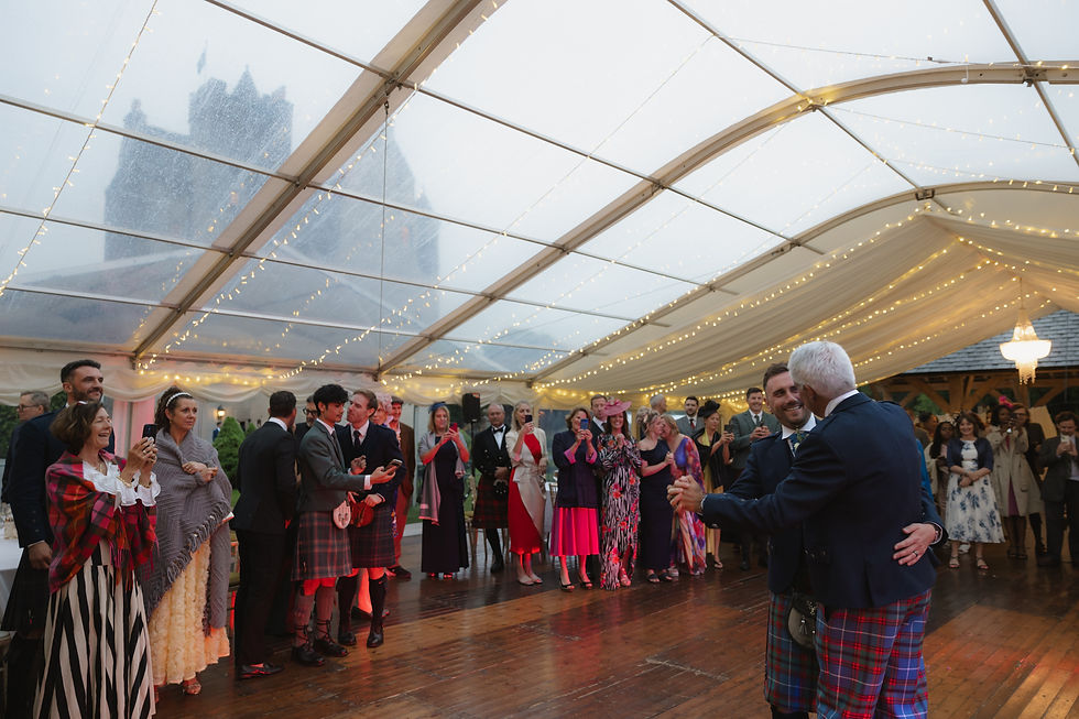 first dance of andy and craig with the castle in the background