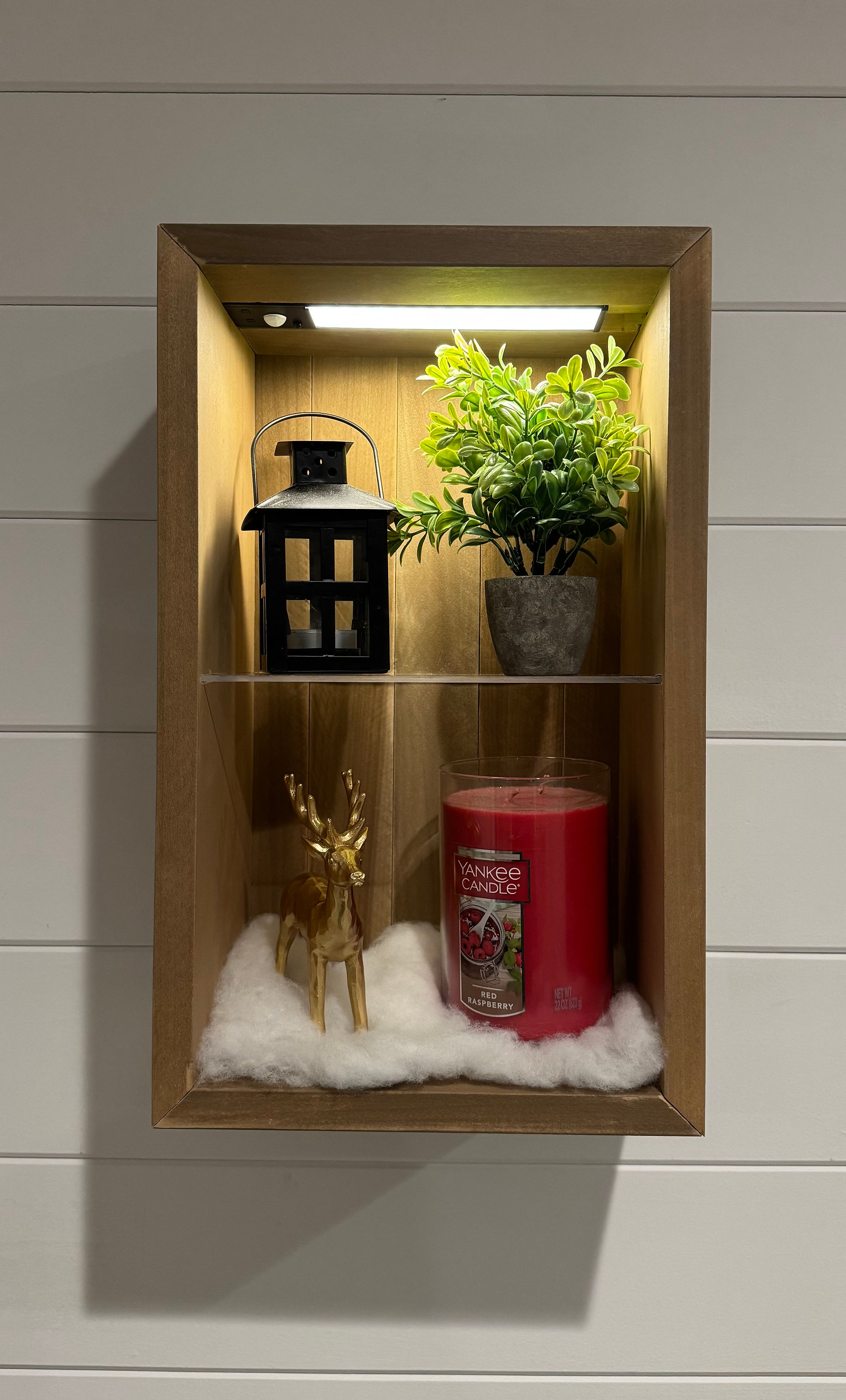Floating cube shelf with built in cabinet lighting.