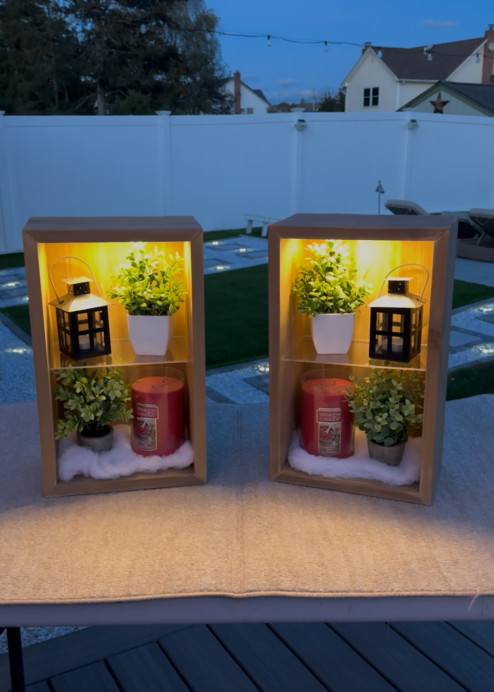 Pair of floating cube shelves with built in cabinet lighting.