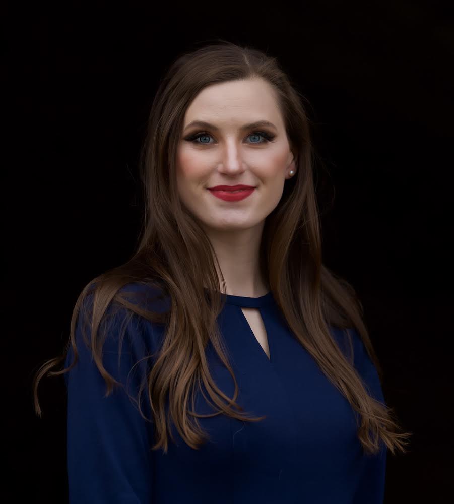 Professional headshot of a female team member smiling.