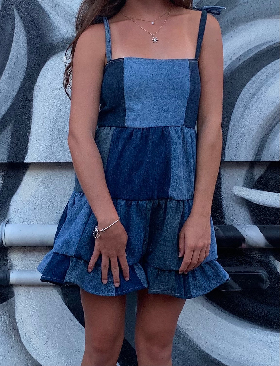 Girl wearing upcycle thrifted jean dress
