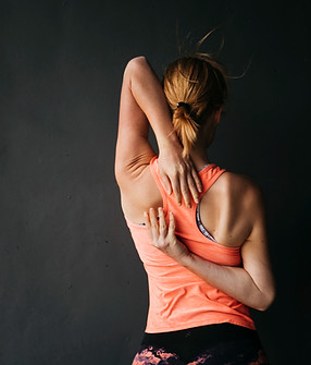 sporty-woman-stretching-urban-environment.jpg