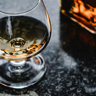 Close-Up Photo of Brown Liquor in a Glass