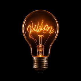 Light bulb with the filament saying vision