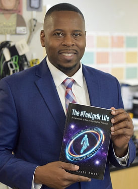 Holding The #FeeLgr8r Life book_edited.jpg