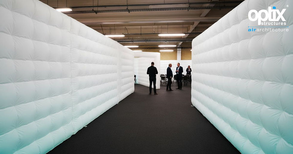 Optix Inflatable Walls forming a clear approach zone inside a conference venue.