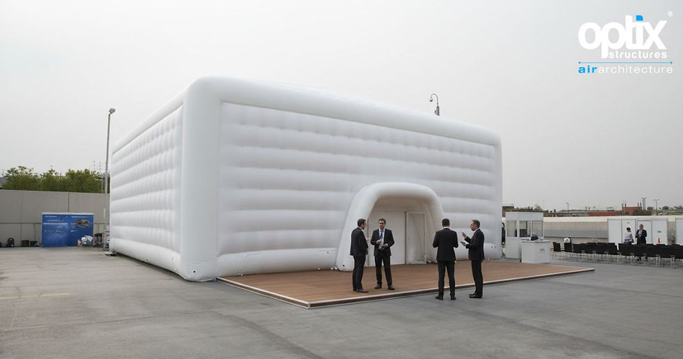 Optix 12 by 6 metre Inflatable Air Roof shown at realistic scale in a corporate exhibition hall.