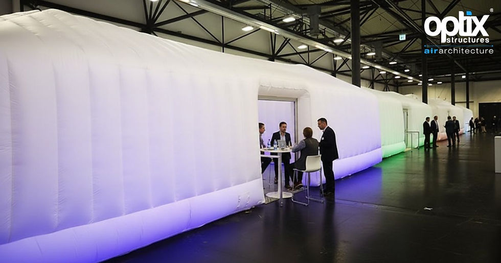 Large Optix 12m Pyramic used as a corporate breakout meeting space in an indoor conference hall.