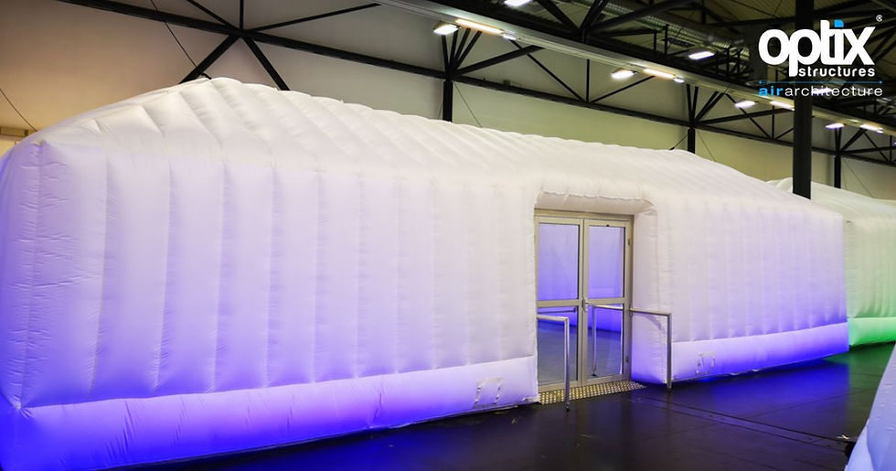 Optix Pyramic roofless inflatable structure used as a large indoor corporate presentation space.