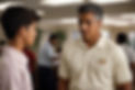 PhotoReal_an_athletic_coach_in_a_golf_shirt_and_slacks_talking_2.jpg