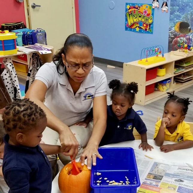 carving a pumpkin at soaring eagles academy