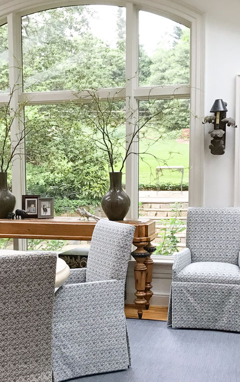 Well lit and thoughtfully furnished sun patio brings the surround natural beauty into the living space in this Great Falls, VA client home.  