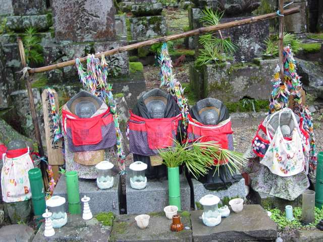 Buddahs in cemetery