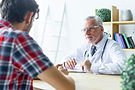 senior-doctor-listening-patient-closely.jpg